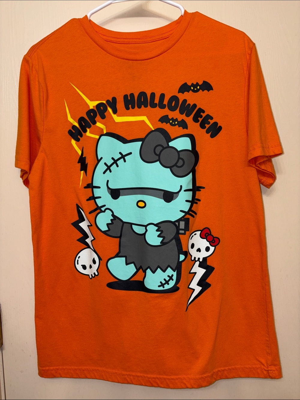 Hello Kitty Orange Tee with Turquoise Zombie Graphic